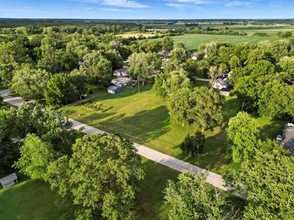 a view of a field with an ocean