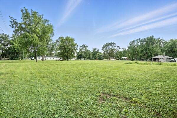 419 Clay Street Morocco, IN 47963 - Photo 9 of 15 a view of a green field with trees in the background
