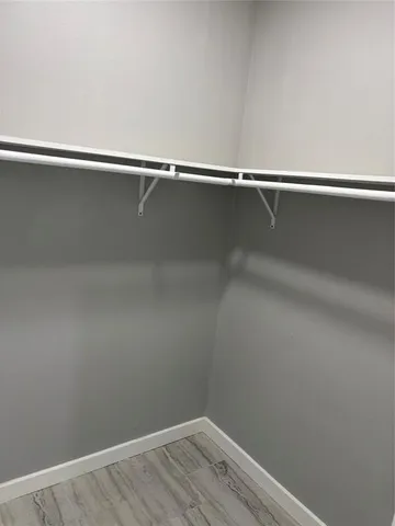 a view of a room with racks on the wall