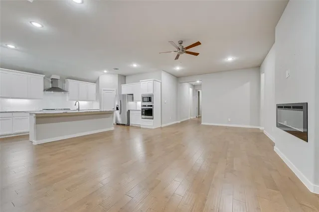 a view of kitchen with wooden floor and window