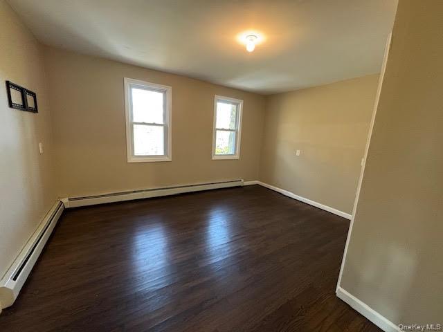 177 Riley Road New Windsor, NY 12553 - Photo 25 of 39 an empty room with wooden floor and windows