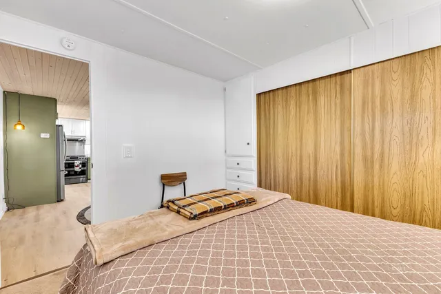 a bathroom with a granite countertop sink and a bathtub