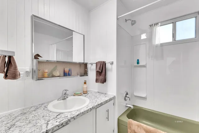 a view of a patio with couple of chairs