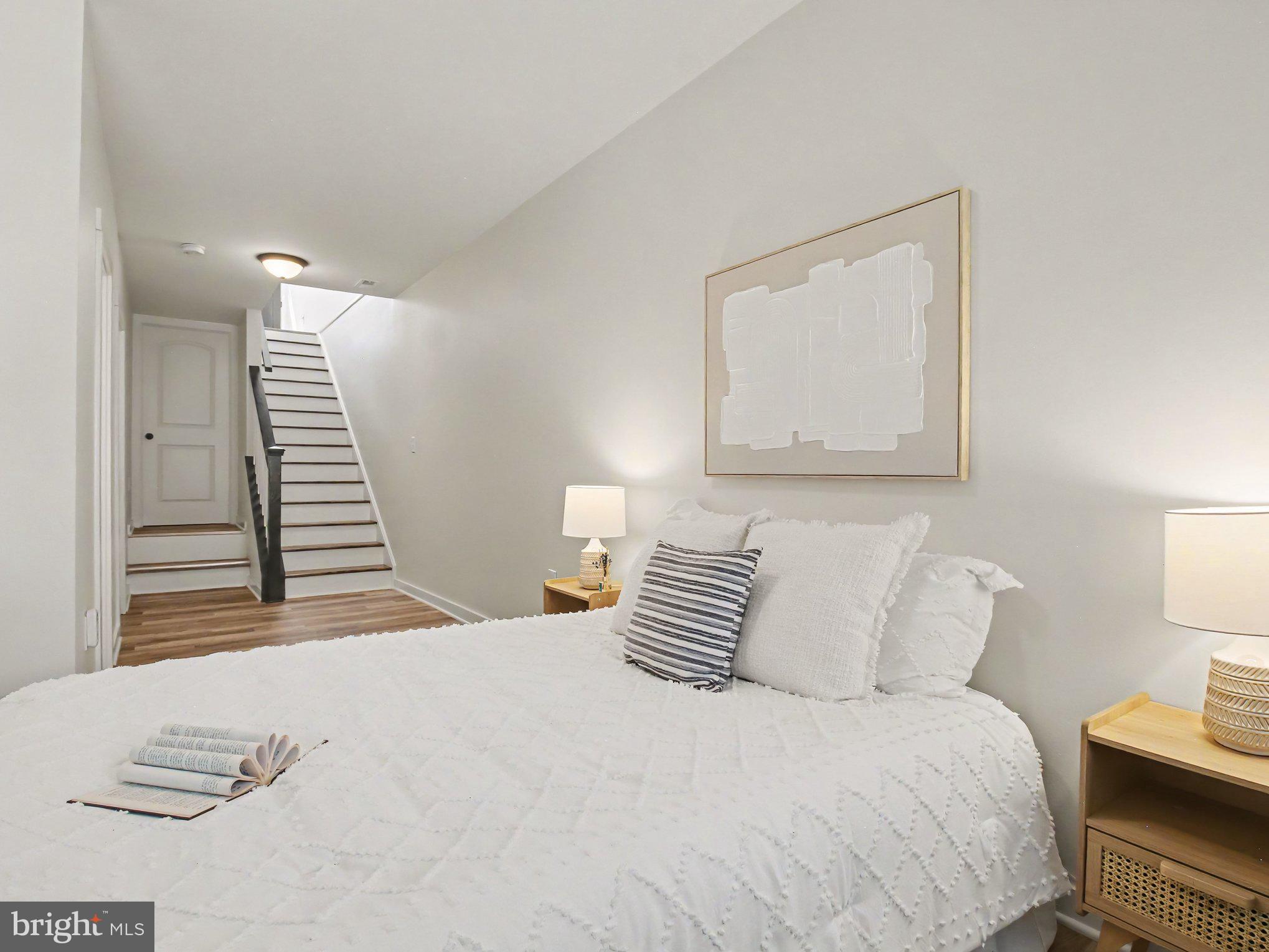 3915 Roland Avenue Baltimore, MD 21211 - Photo 20 of 26 a bedroom with a bed and a night stand