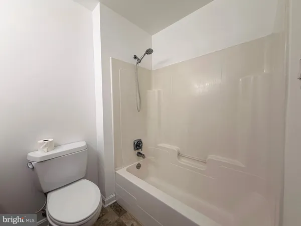 a backyard of a house with trees and houses