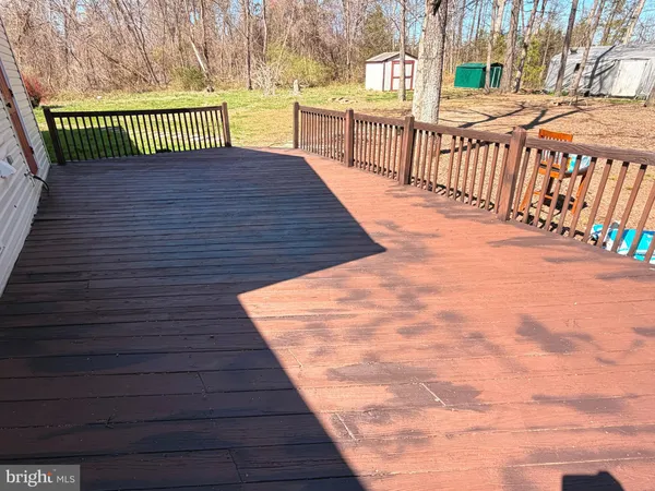 a view of outdoor space with deck and wooden floor