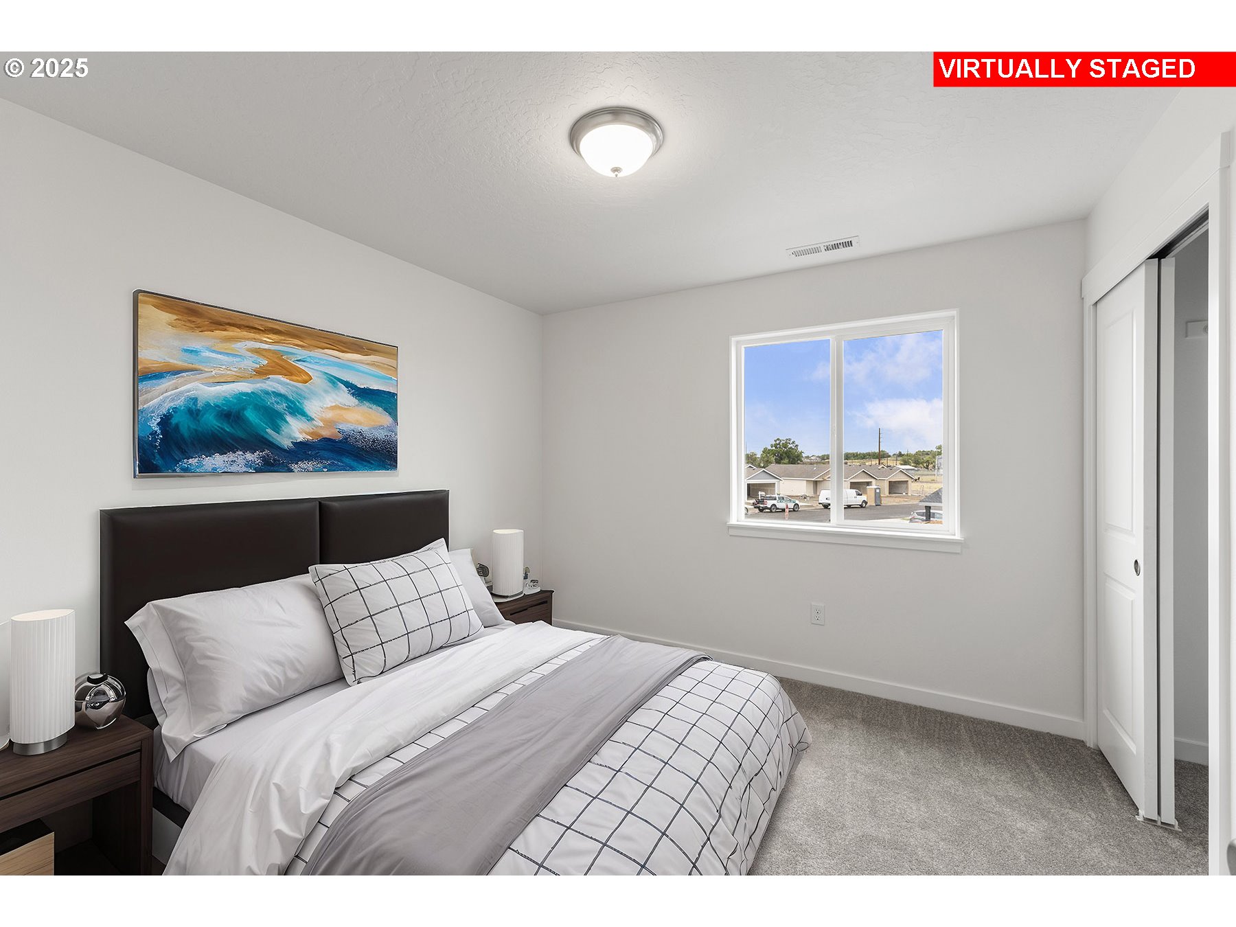 Northeast Emerald Drive Hermiston, OR 97838 - Photo 5 of 11 a bedroom with a bed and a painting on the wall