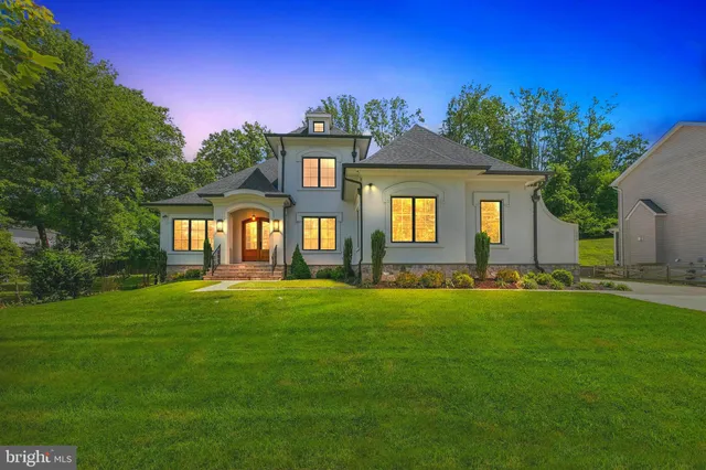 a view of a house with swimming pool and a yard