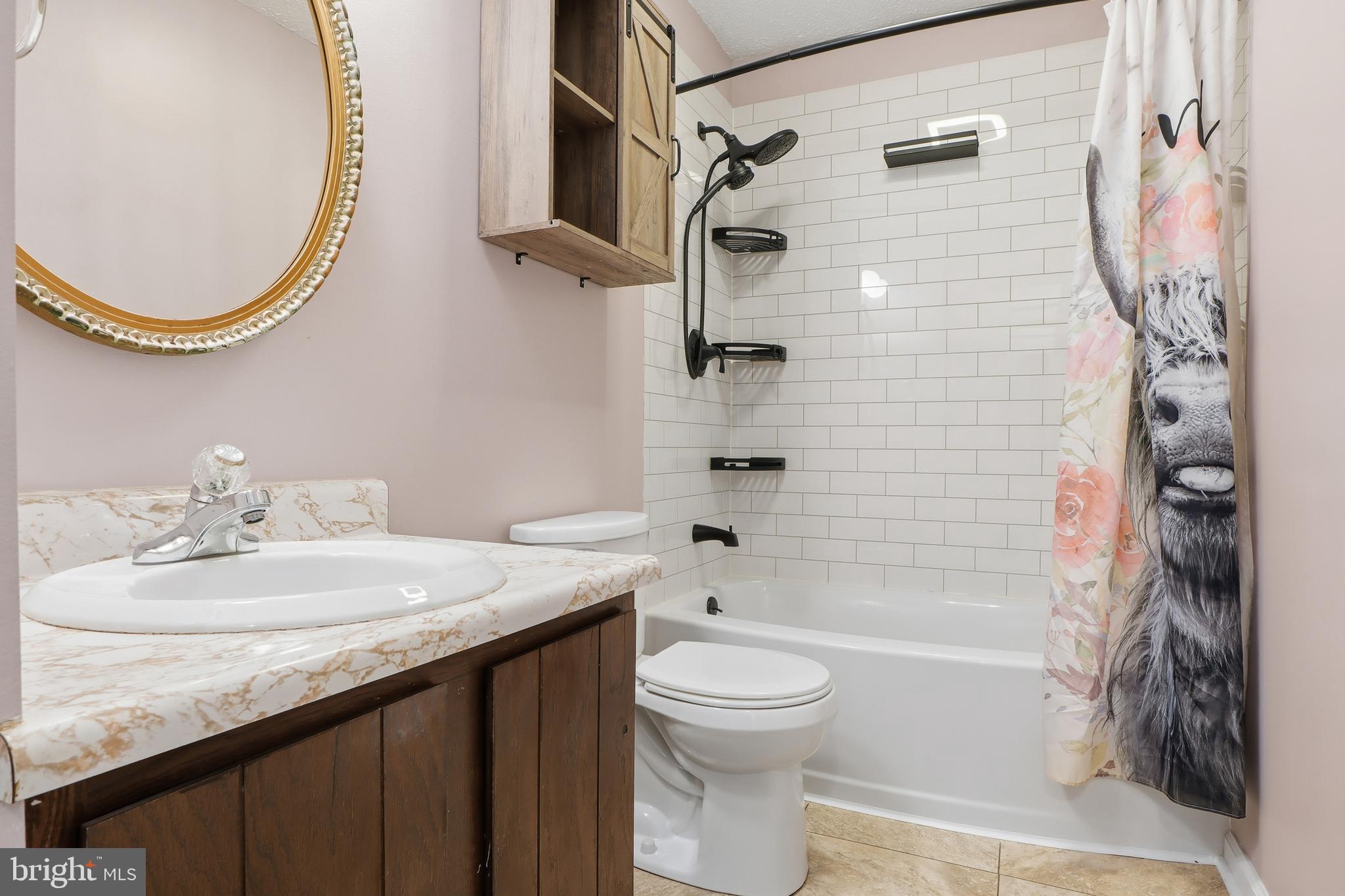 276 Oakbrook Drive Felton, PA 17322 - Photo 12 of 55 a bathroom with a granite countertop sink toilet and shower