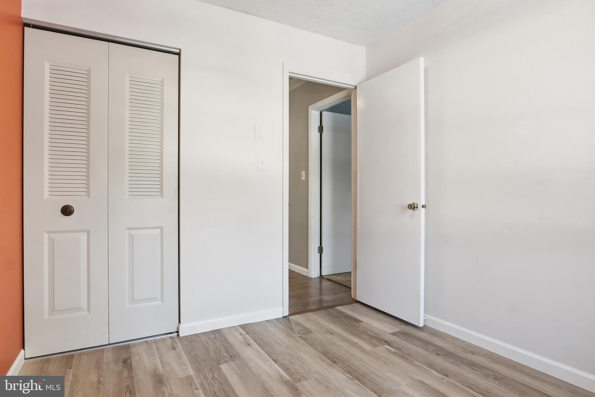 276 Oakbrook Drive Felton, PA 17322 - Photo 19 of 55 an empty room with wooden floor and closet area
