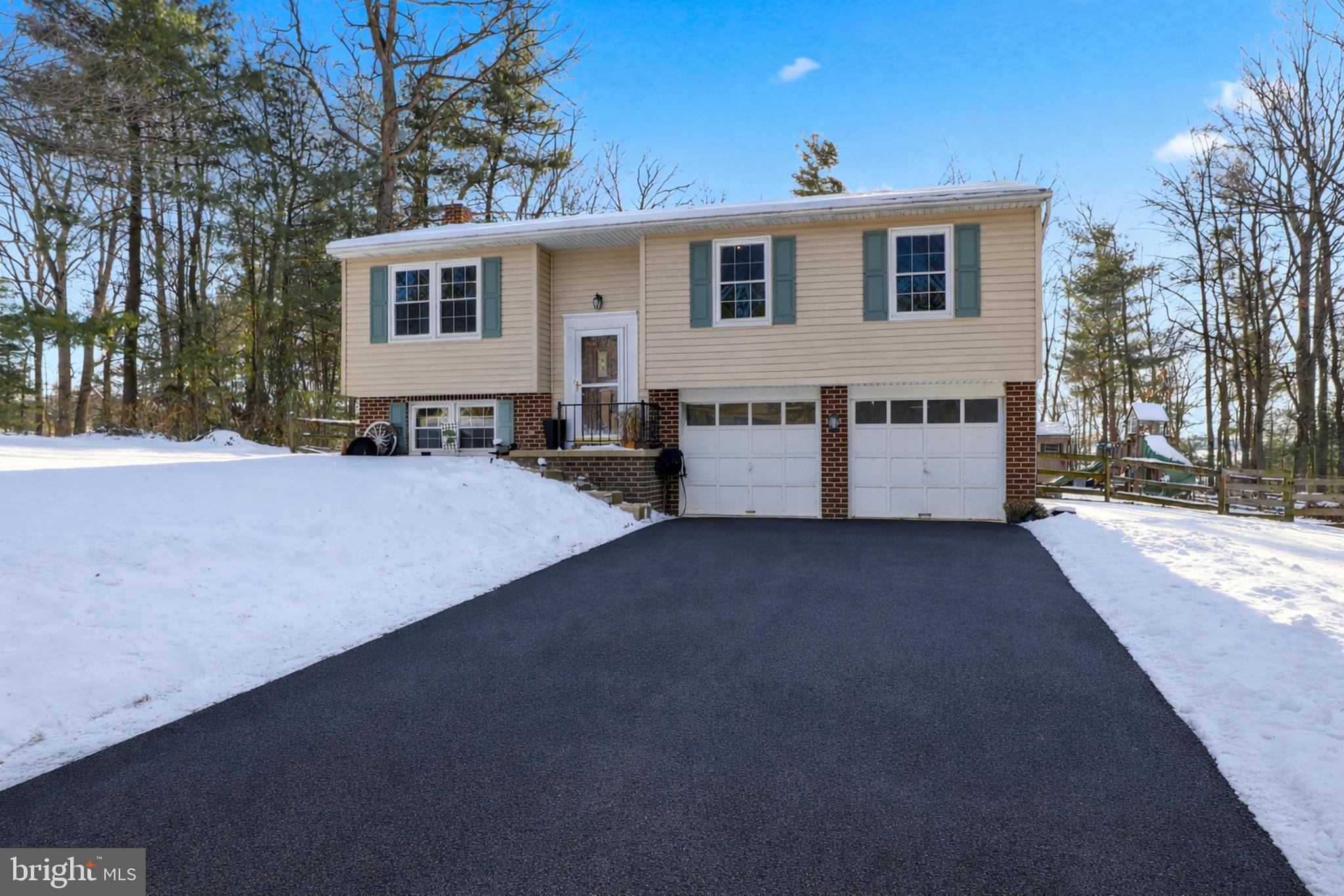276 Oakbrook Drive Felton, PA 17322 - Photo 30 of 55 a front view of a house with a yard