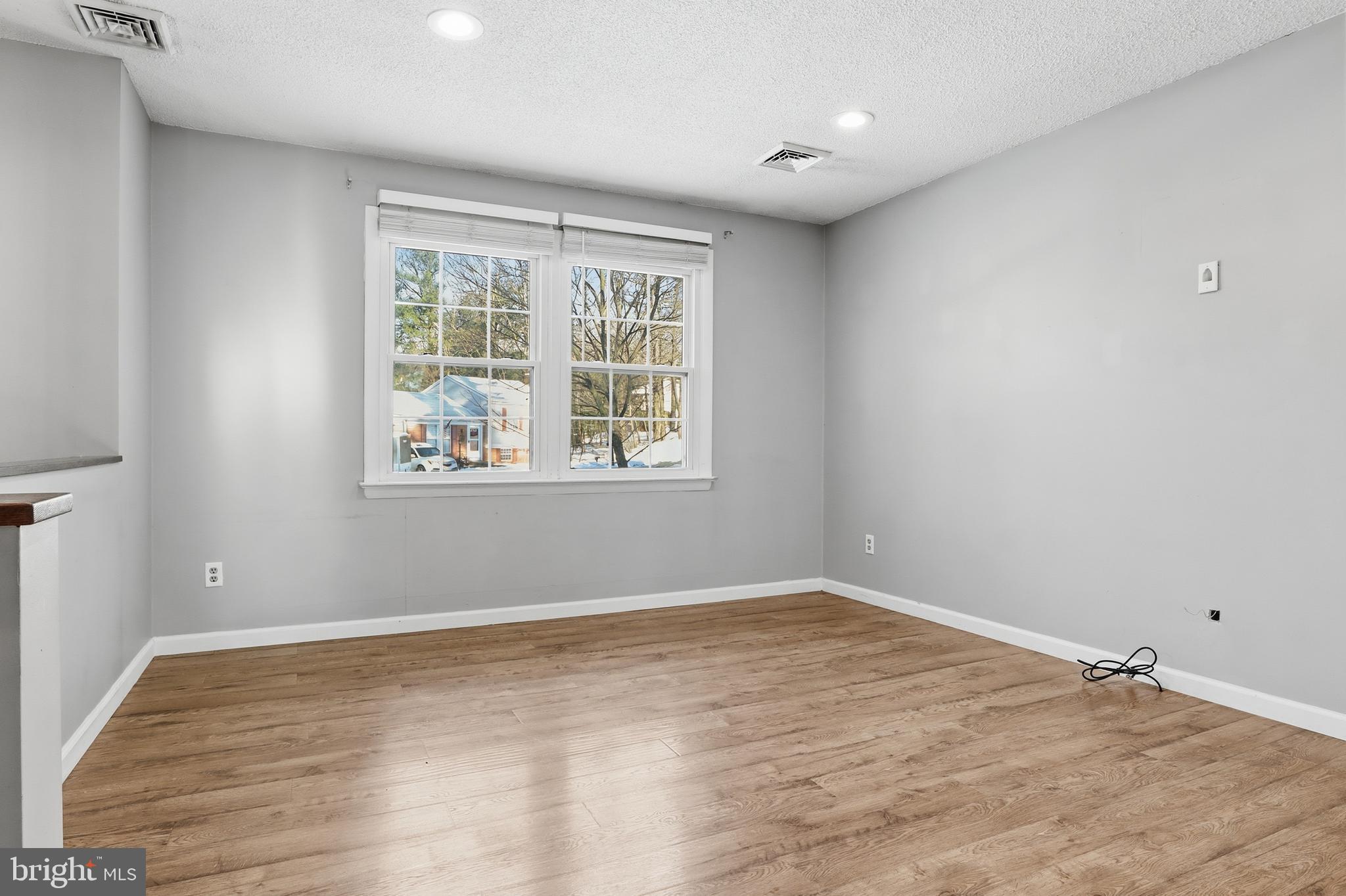 276 Oakbrook Drive Felton, PA 17322 - Photo 3 of 55 a view of empty room with wooden floor and fan