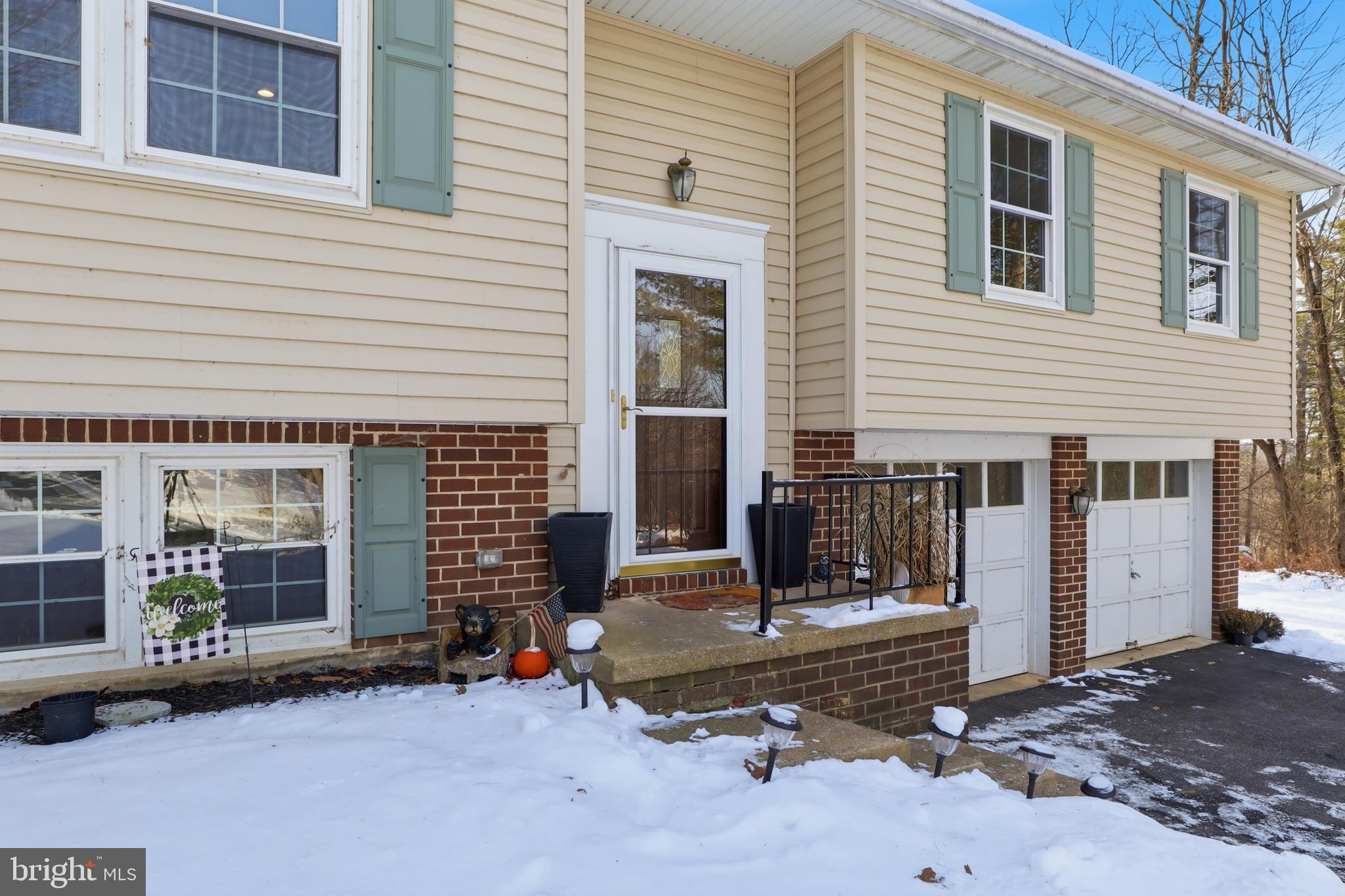 276 Oakbrook Drive Felton, PA 17322 - Photo 33 of 55 a front view of a house with a garage