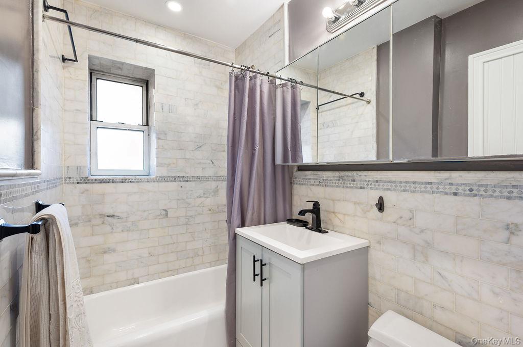 70 Locust Avenue, Unit B101 New Rochelle, NY 10801 - Photo 11 of 11 a bathroom with a sink and a bathtub