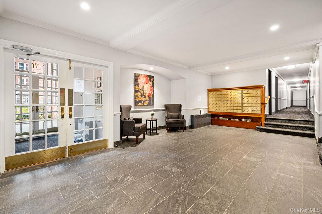 70 Locust Avenue, Unit B101 New Rochelle, NY 10801 - Photo 4 of 11 a view of a livingroom with workspace and a window