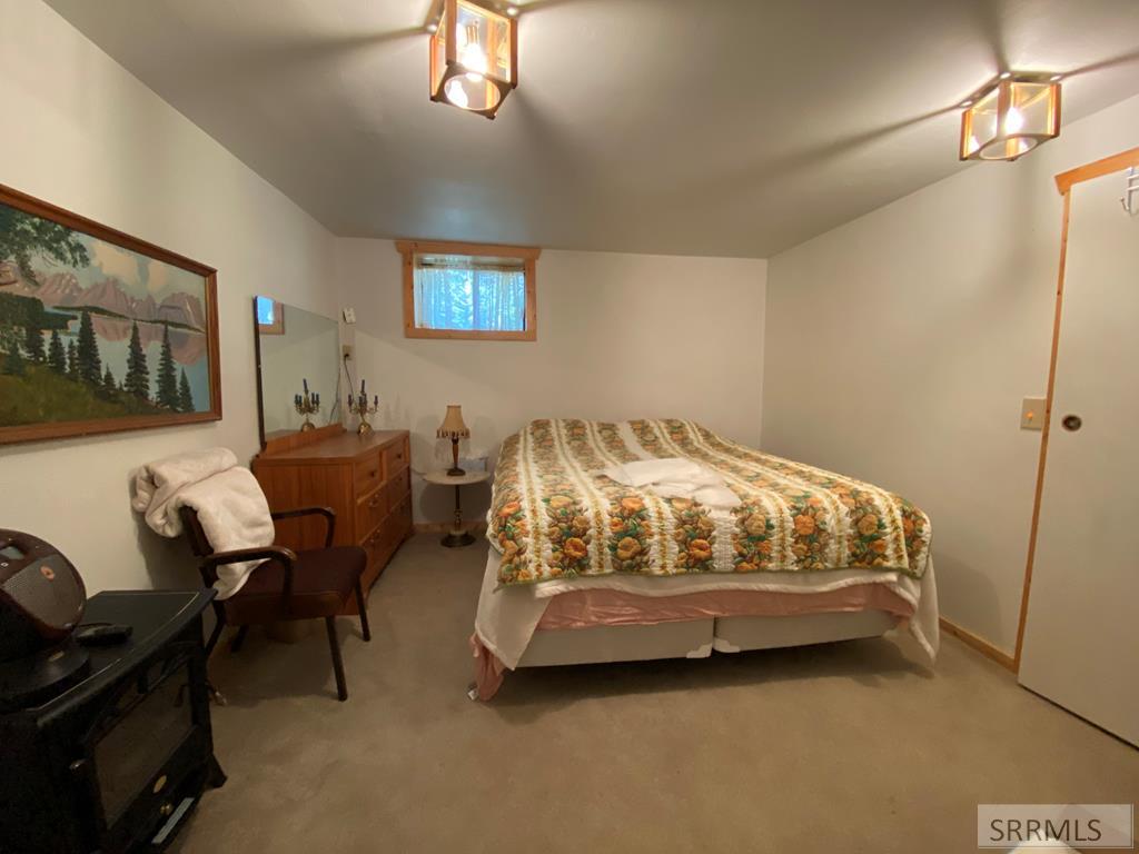 3616 Red Rock Road Island Park, ID 83429 - Photo 31 of 45 Down bedroom
