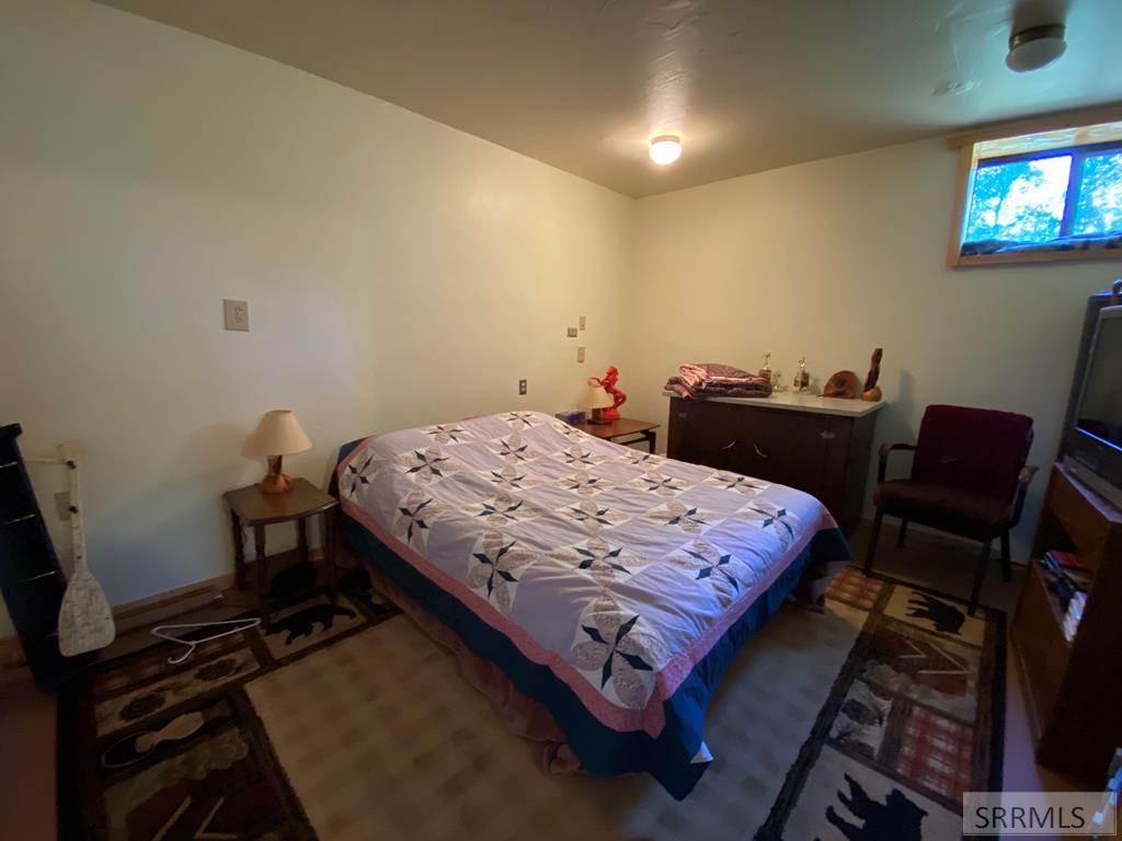 3616 Red Rock Road Island Park, ID 83429 - Photo 32 of 45 Down bedroom