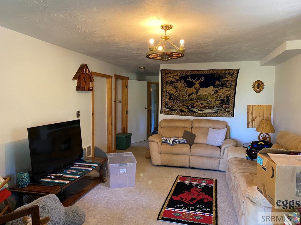 3616 Red Rock Road Island Park, ID 83429 - Photo 35 of 45 Lower level livingroom