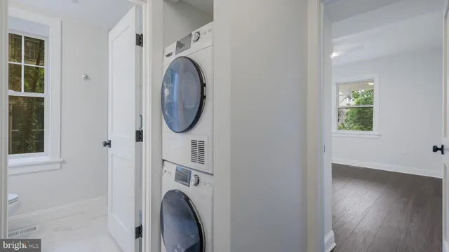 a view of a hallway with washer and dryer