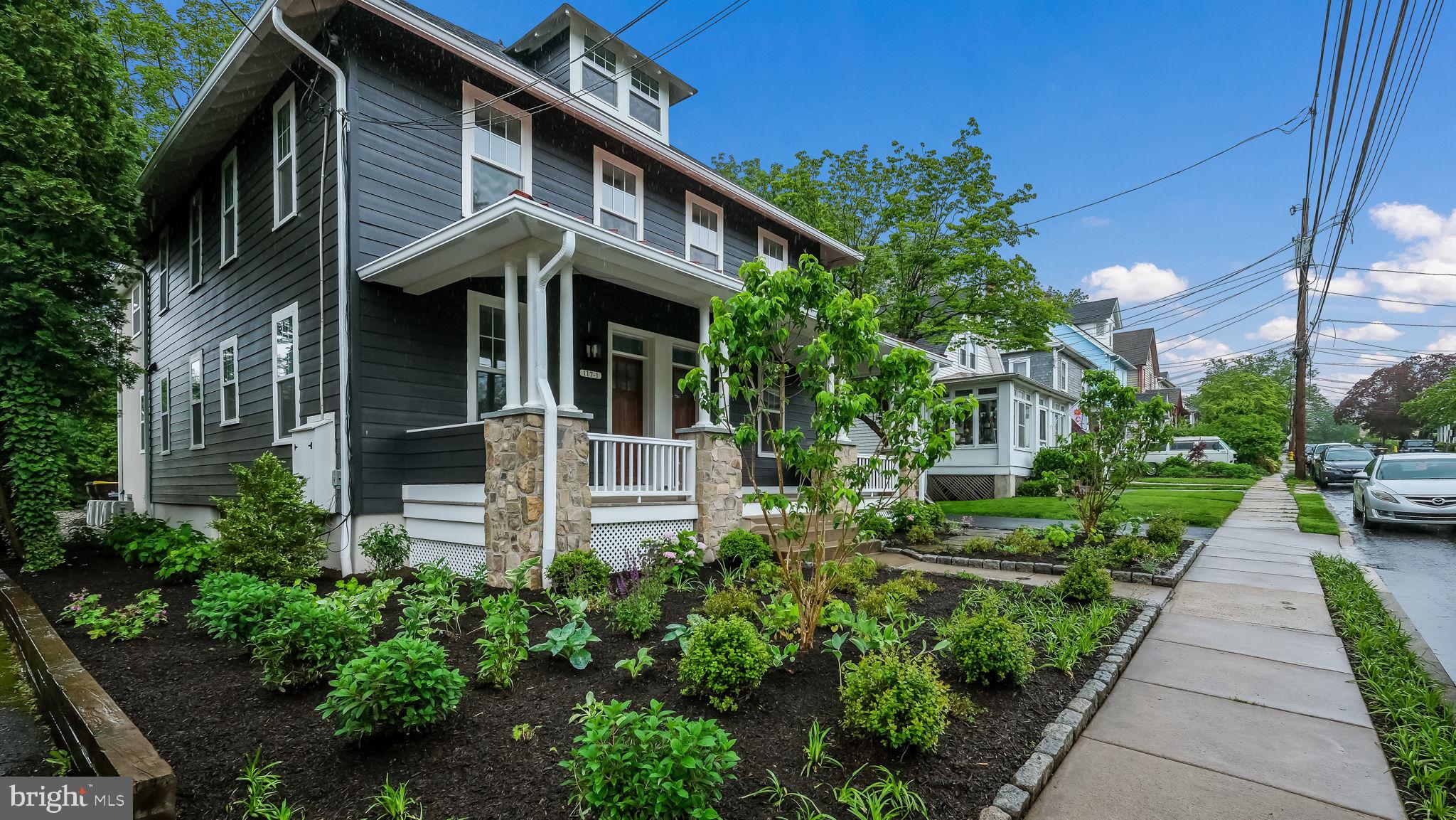 115 Harvey Avenue, Unit 1171 Doylestown, PA 18901 - Photo 2 of 26 a front view of a house with a garden