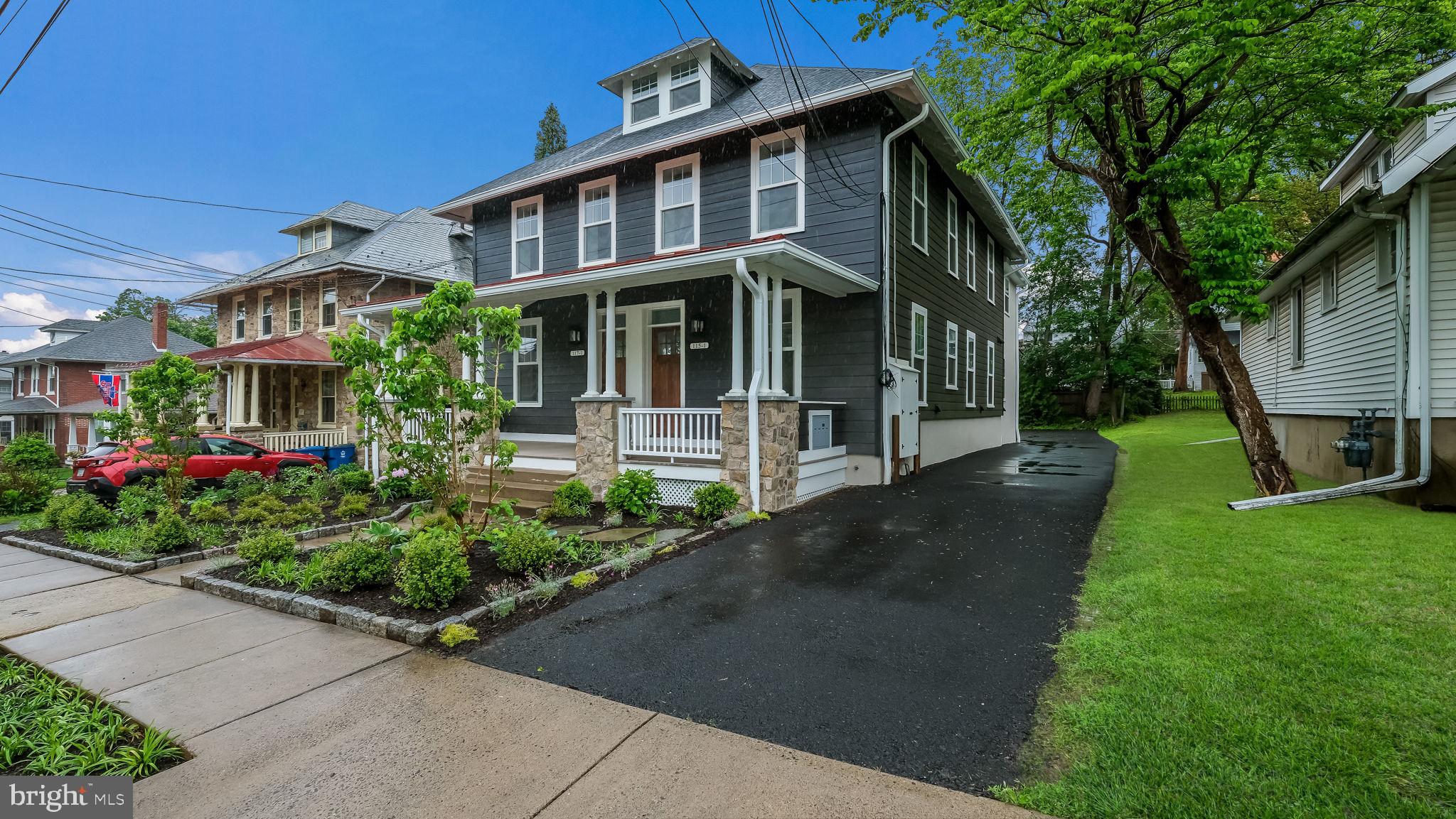 115 Harvey Avenue, Unit 1171 Doylestown, PA 18901 - Photo 3 of 26 a front view of a house with a yard