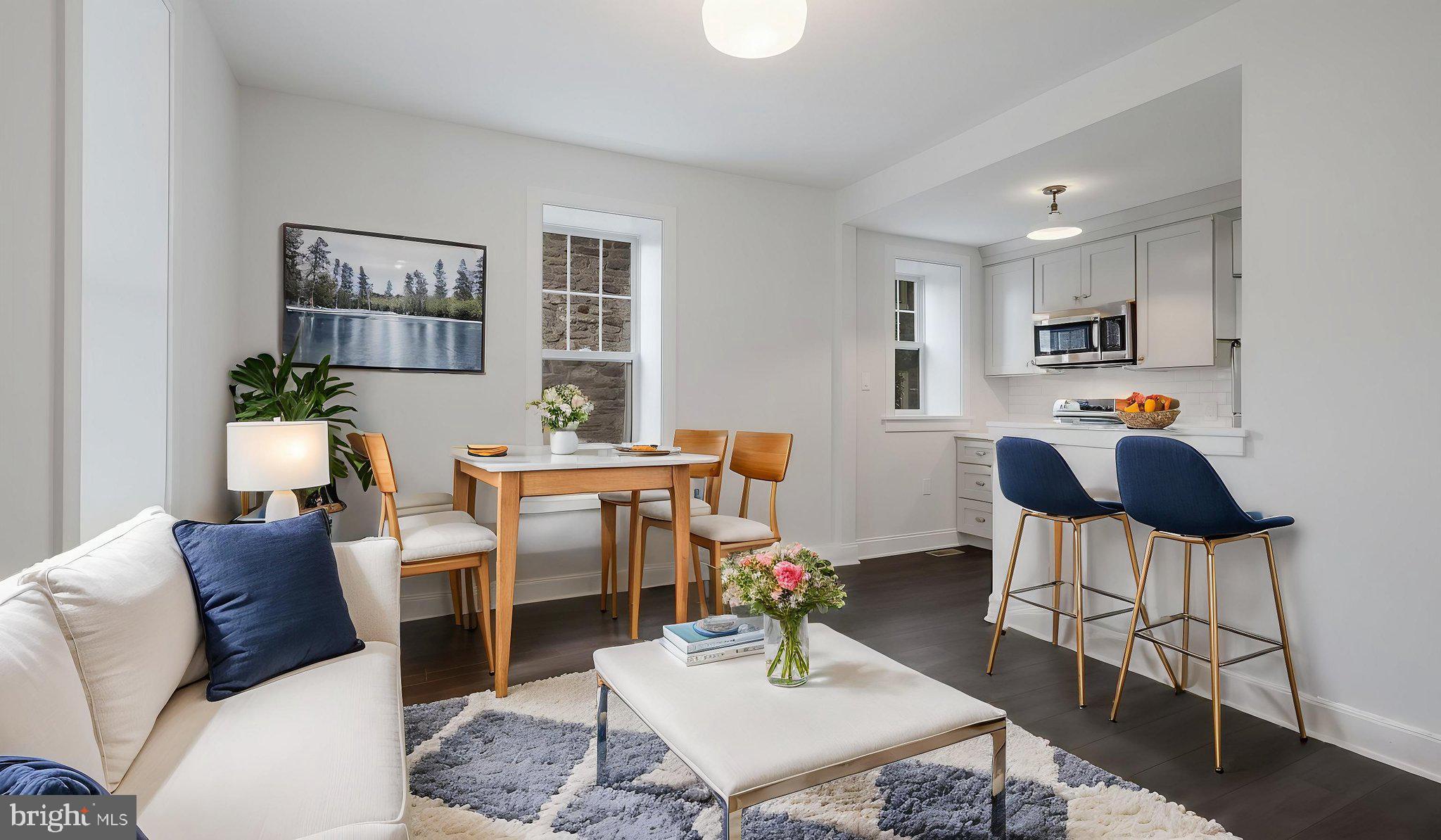 115 Harvey Avenue, Unit 1171 Doylestown, PA 18901 - Photo 8 of 26 a living room with furniture and a wooden floor