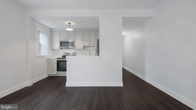 a view of kitchen with wooden floor