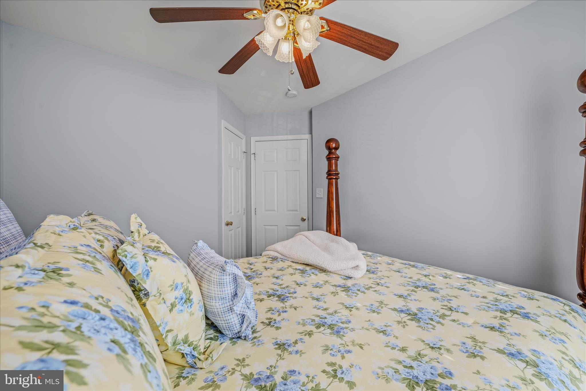 43 Scarboro Drive Bunker Hill, WV 25413 - Photo 24 of 43 a bedroom with a bed and a chandelier