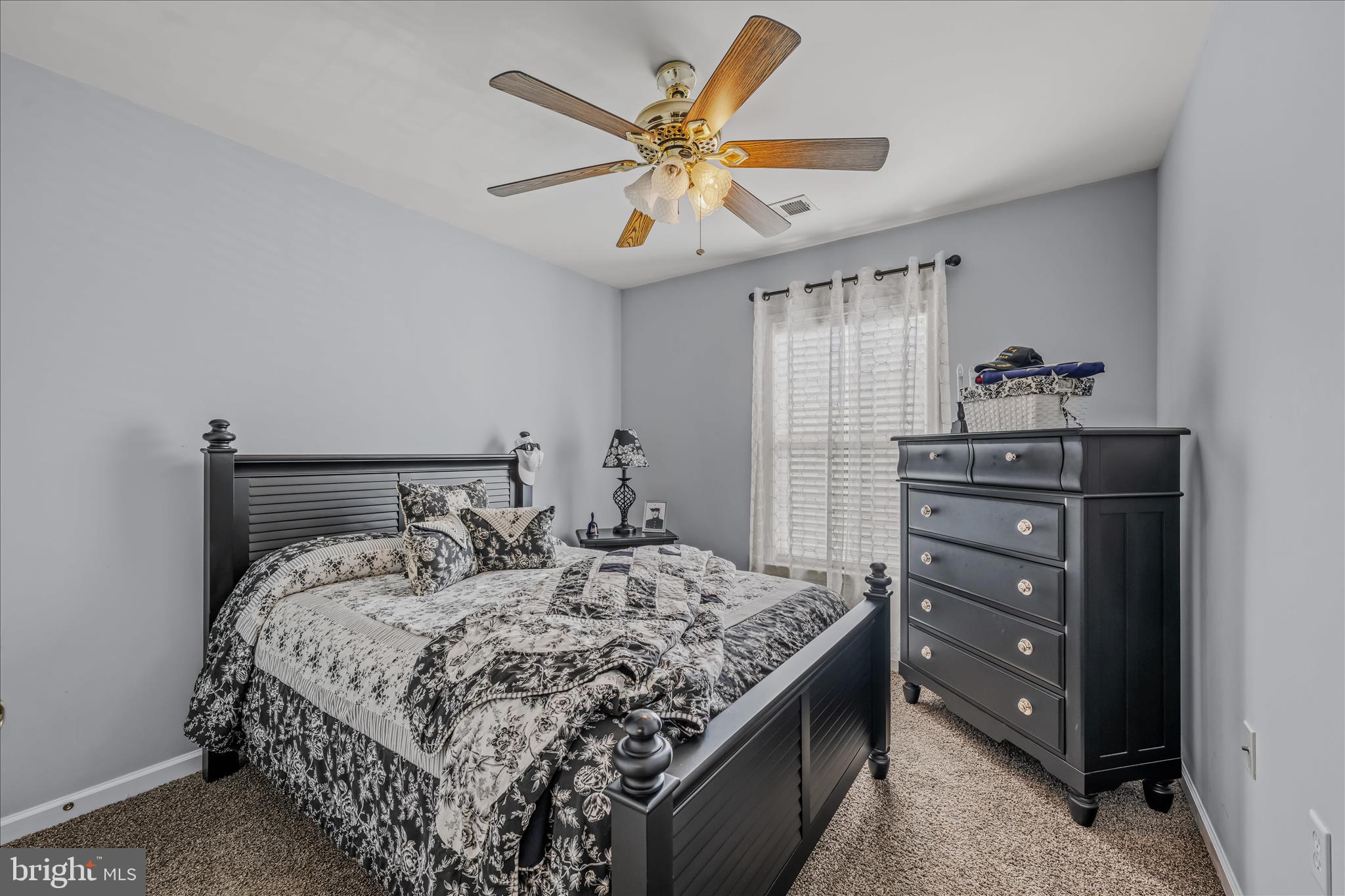 43 Scarboro Drive Bunker Hill, WV 25413 - Photo 25 of 43 a bedroom with a bed and a chandelier