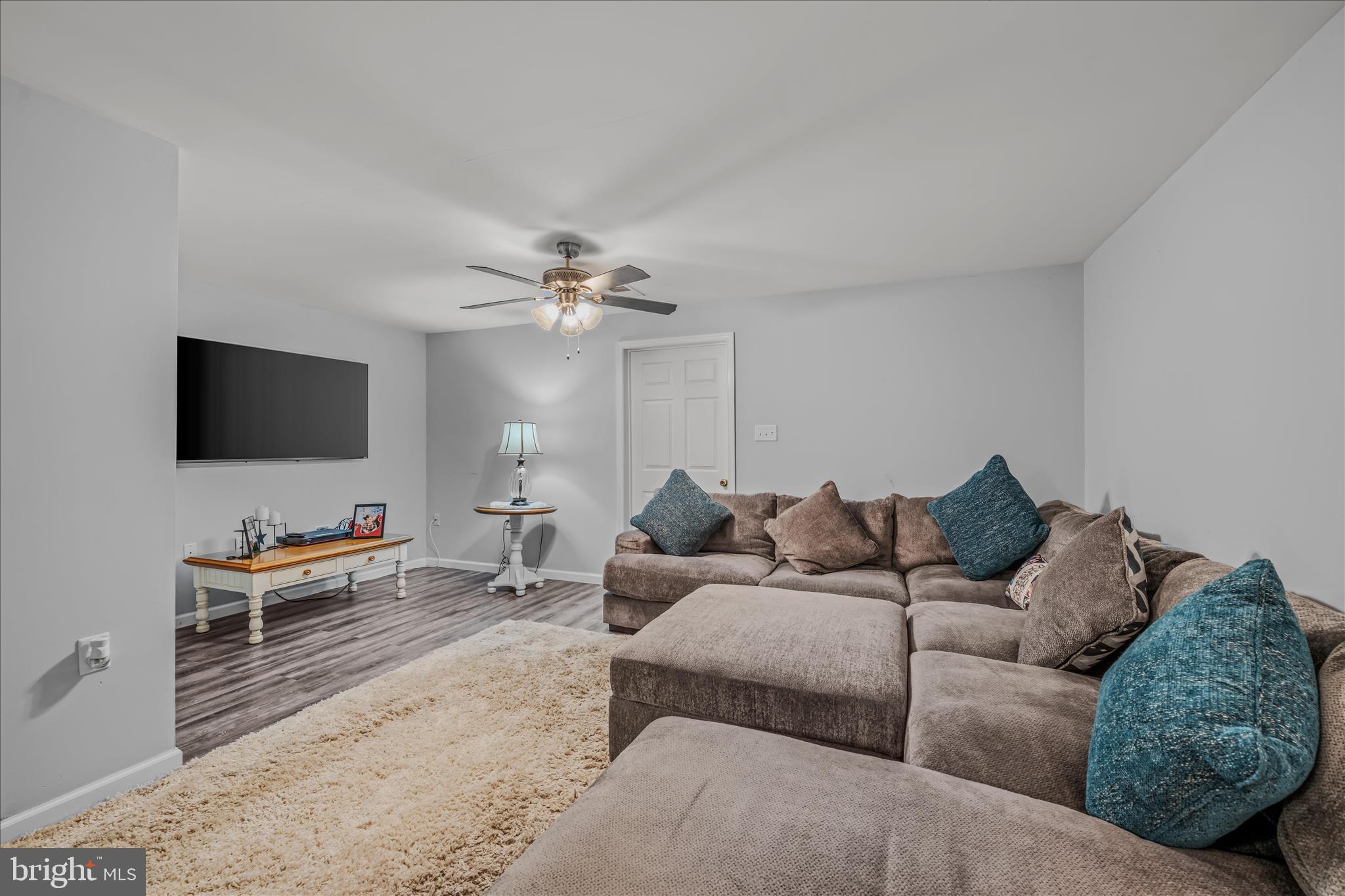 43 Scarboro Drive Bunker Hill, WV 25413 - Photo 29 of 43 a living room with furniture and a flat screen tv