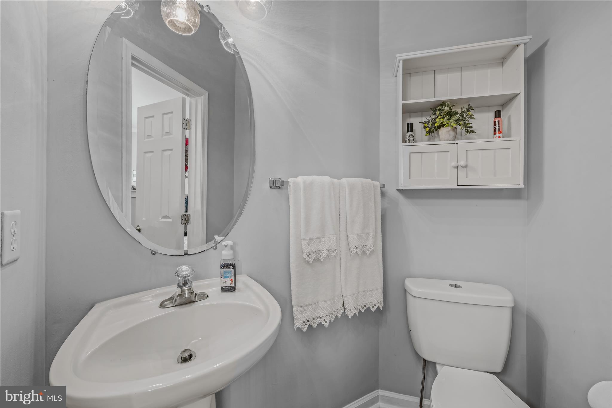 43 Scarboro Drive Bunker Hill, WV 25413 - Photo 8 of 43 a bathroom with a toilet sink and mirror