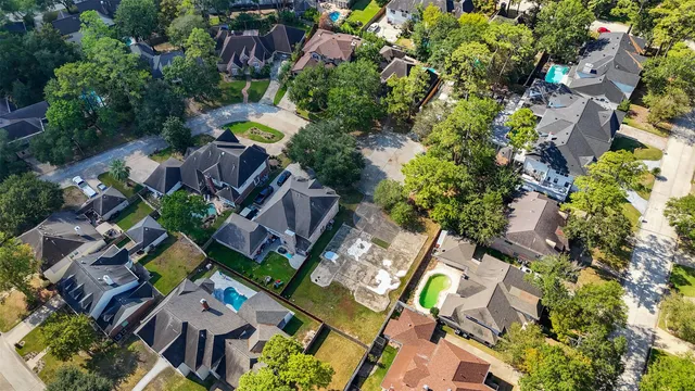 an aerial view of residential house with swimming pool and outdoor space