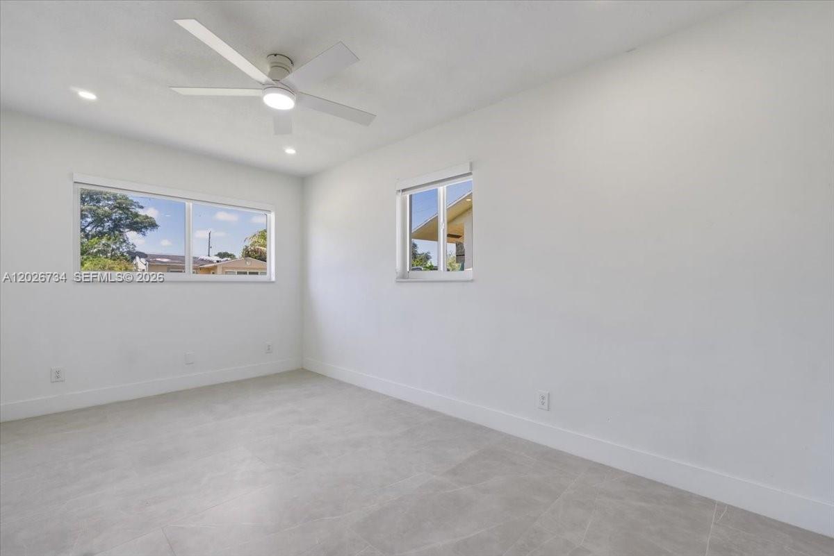 266 Southwest 6th Street Dania Beach, FL 33004 - Photo 15 of 37 an empty room with windows and refrigerator