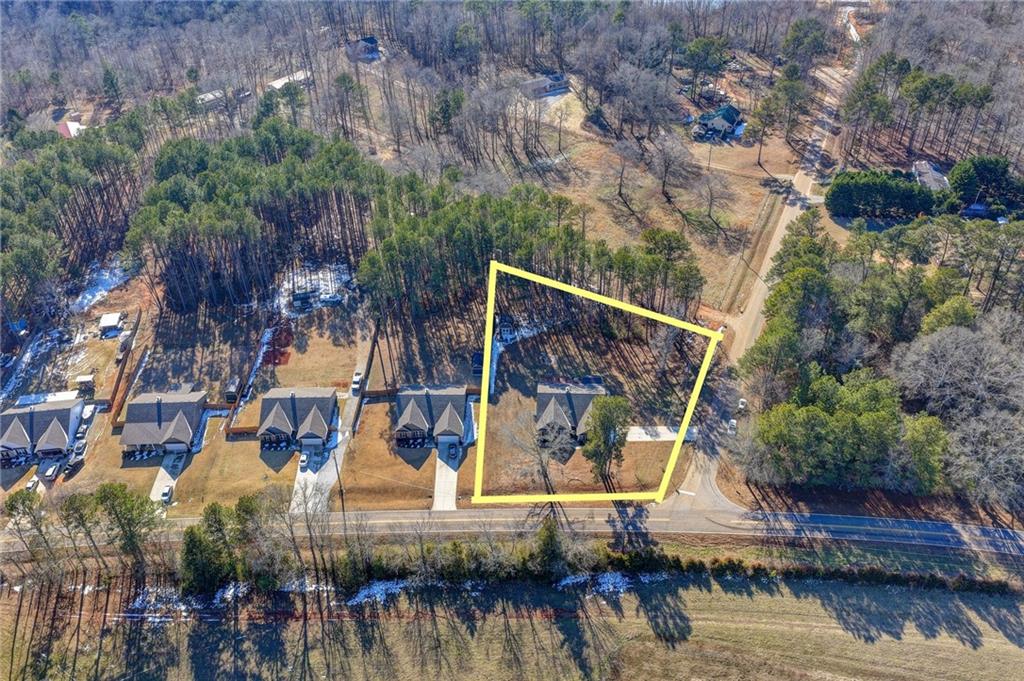 204 Lynn Road Bethlehem, GA 30620 - Photo 27 of 44 a view of house with river and trees in the background