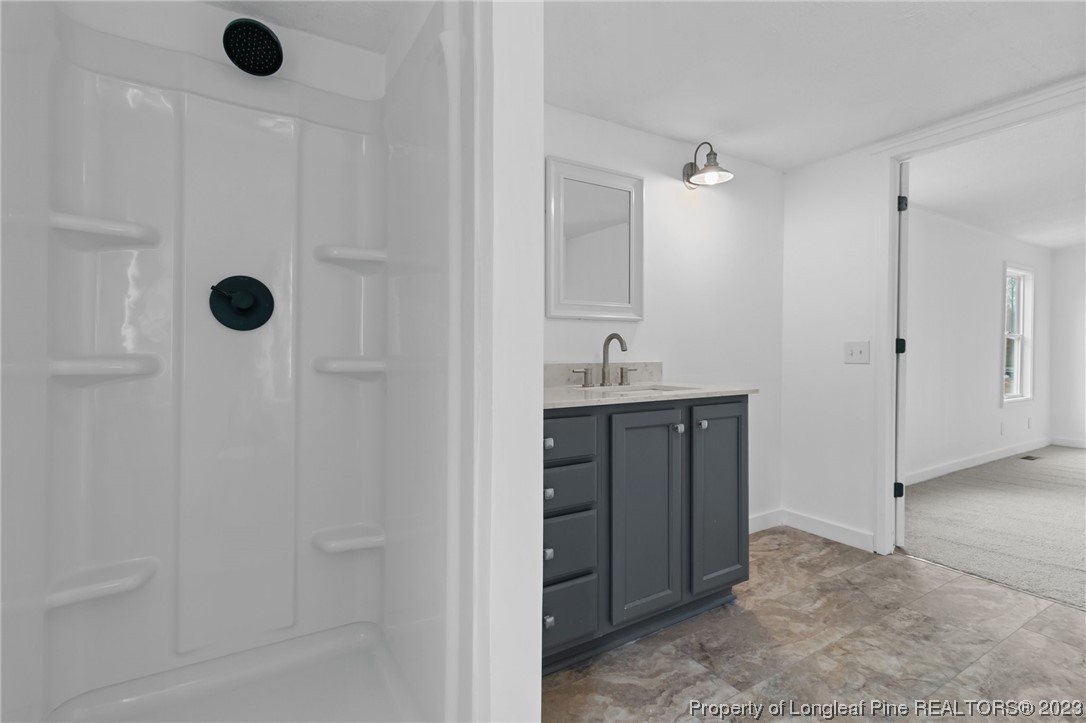 420 Ridge Lane Autryville, NC 28318 - Photo 13 of 39 a bathroom with a shower