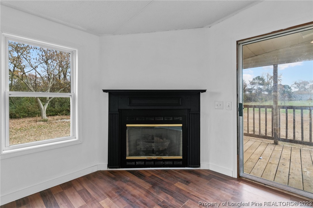 420 Ridge Lane Autryville, NC 28318 - Photo 20 of 39 a view of an empty room with wooden floor and a window