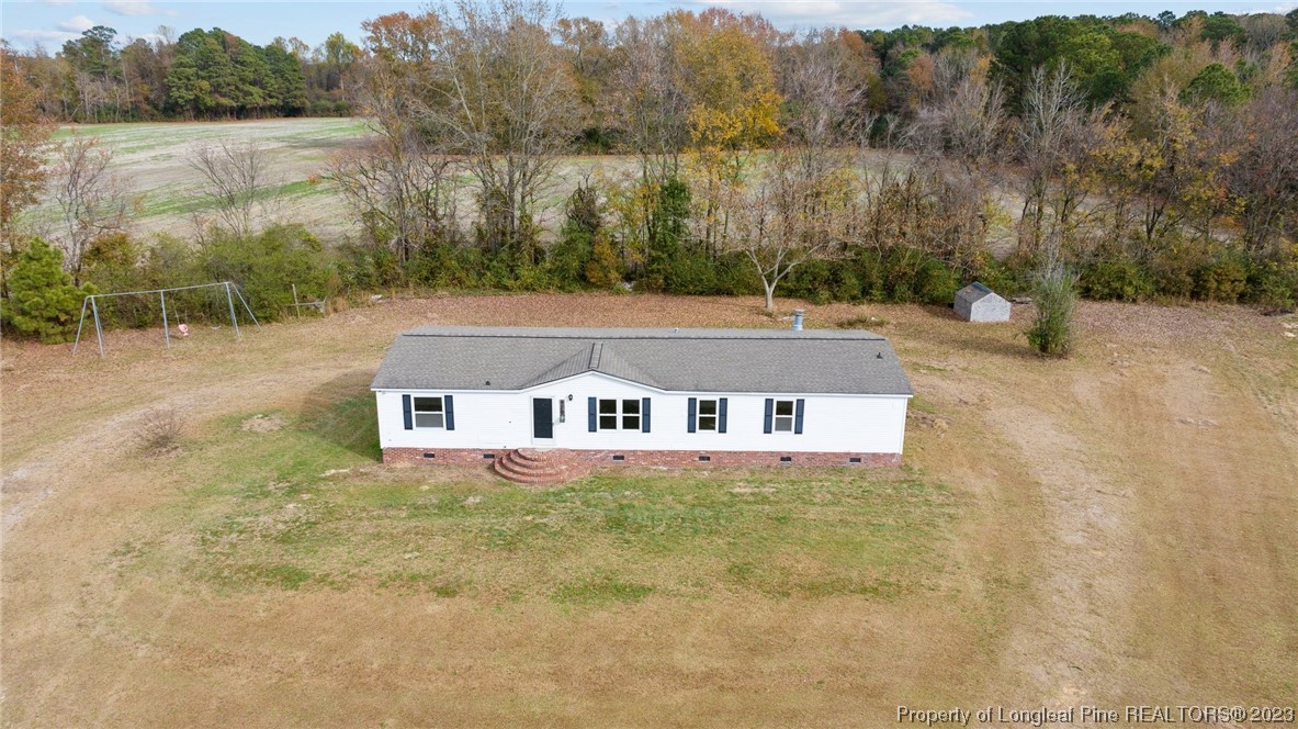 420 Ridge Lane Autryville, NC 28318 - Photo 2 of 39 a aerial view of a house with a yard and a large tree