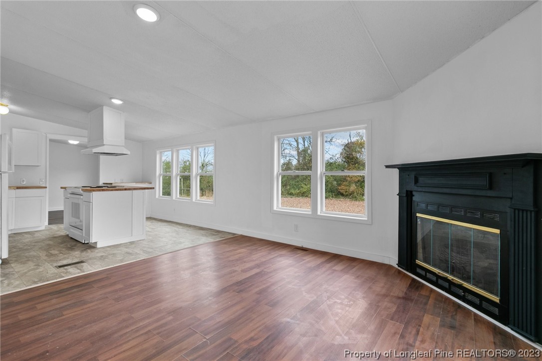 420 Ridge Lane Autryville, NC 28318 - Photo 21 of 39 a view of an empty room with a kitchen and a window