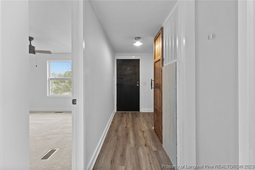 420 Ridge Lane Autryville, NC 28318 - Photo 28 of 39 a view of hallway with wooden floor