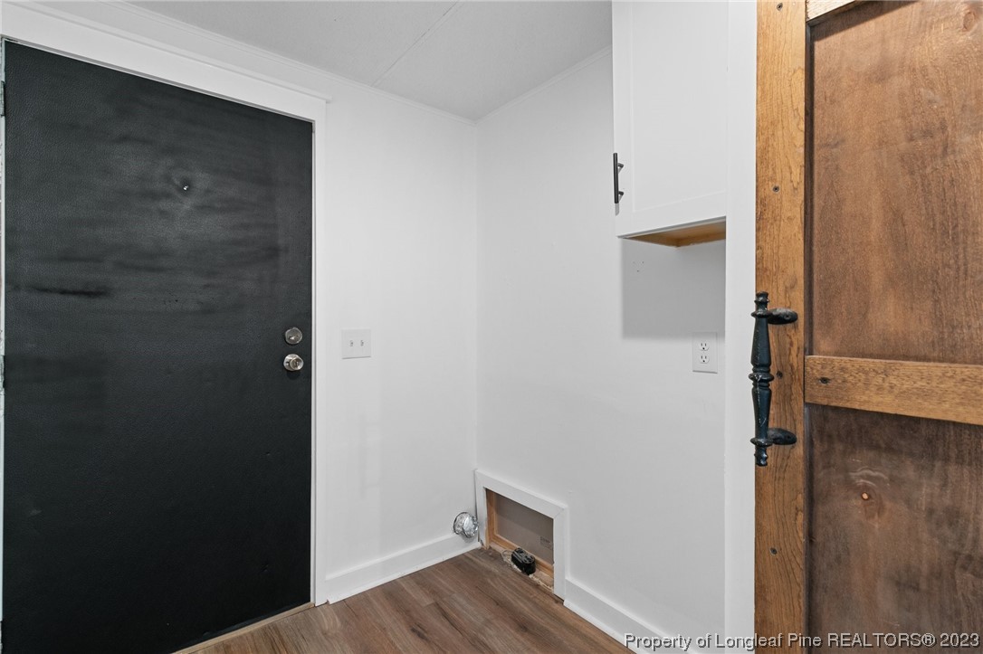 420 Ridge Lane Autryville, NC 28318 - Photo 29 of 39 a view of hallway with wooden floor