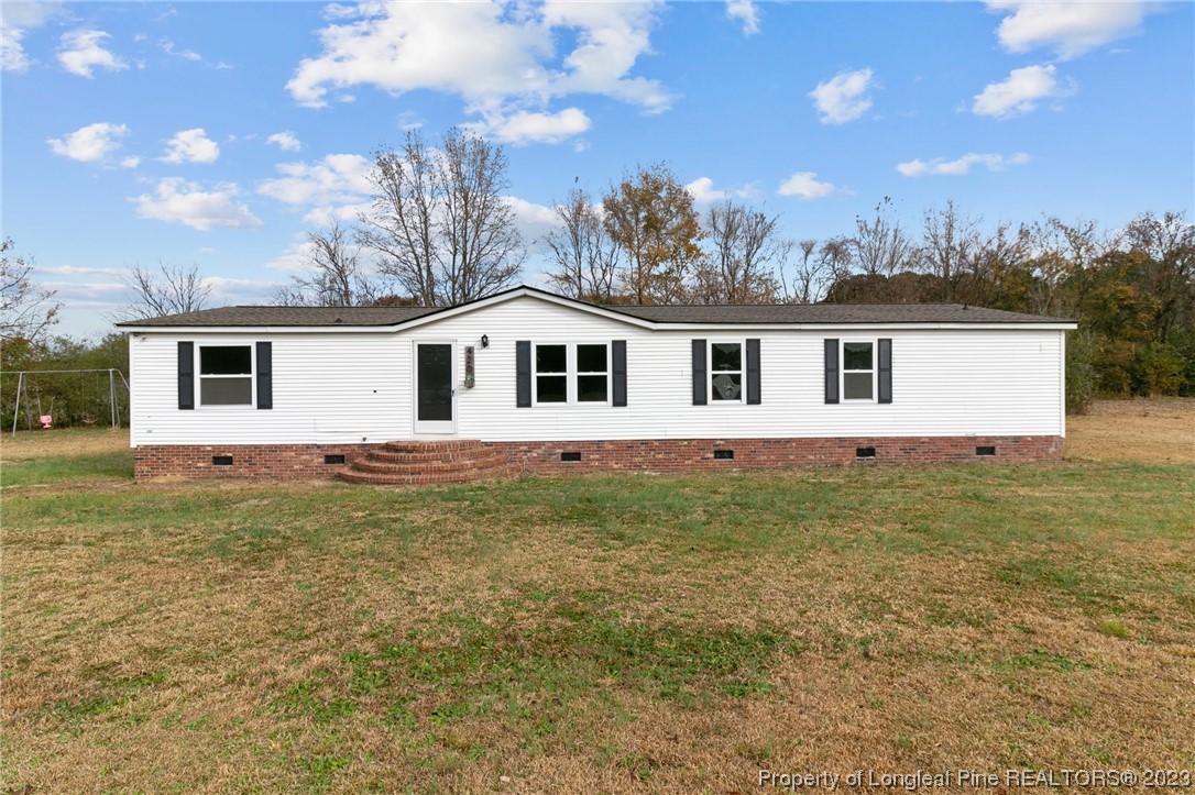 420 Ridge Lane Autryville, NC 28318 - Photo 31 of 39 a view of a house with a backyard