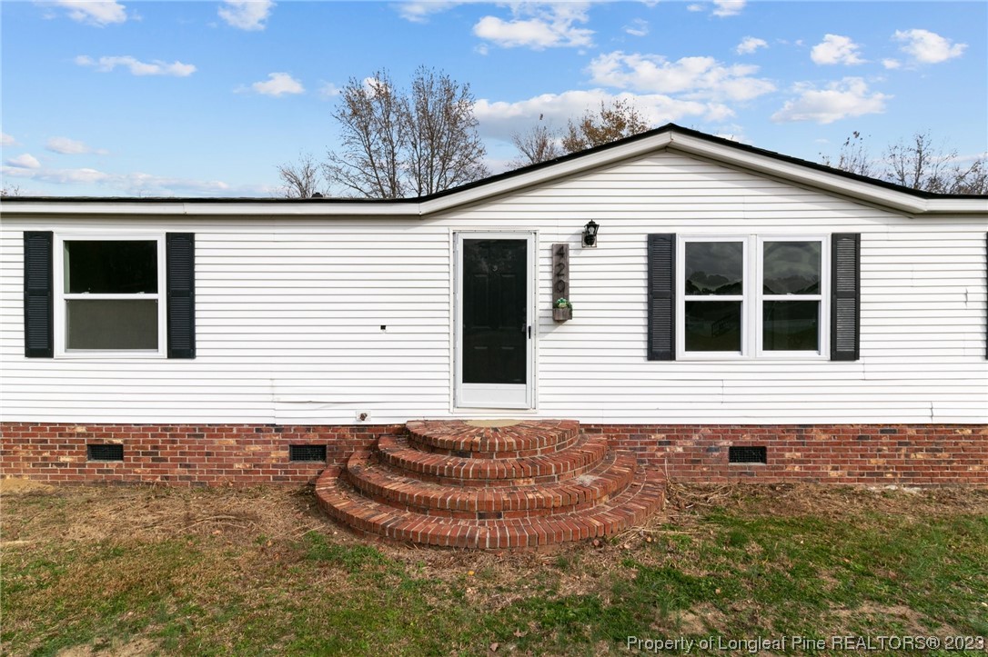 420 Ridge Lane Autryville, NC 28318 - Photo 33 of 39 a view of a house with a yard