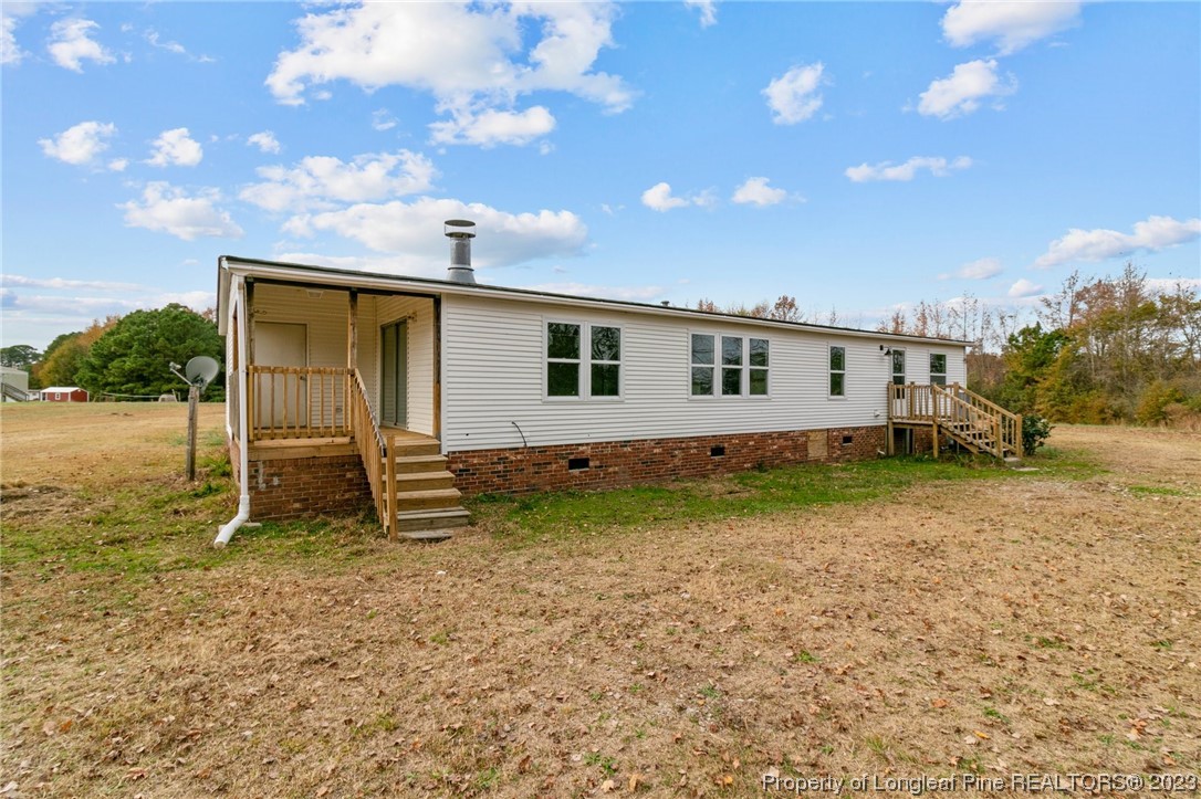 420 Ridge Lane Autryville, NC 28318 - Photo 35 of 39 a house view with a backyard space