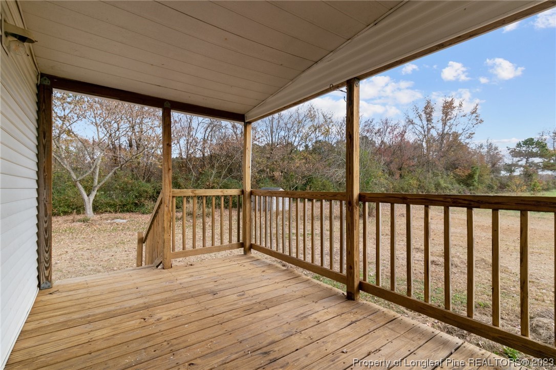 420 Ridge Lane Autryville, NC 28318 - Photo 38 of 39 a view of balcony with wooden floor