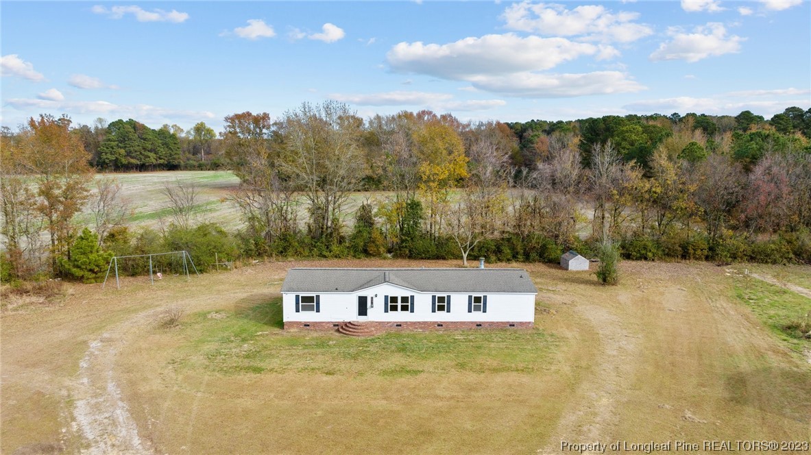 420 Ridge Lane Autryville, NC 28318 - Photo 6 of 39 a view of a lake with a mountain in the background