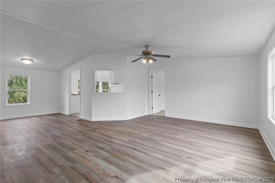 420 Ridge Lane Autryville, NC 28318 - Photo 8 of 39 wooden floor in an empty room with a window