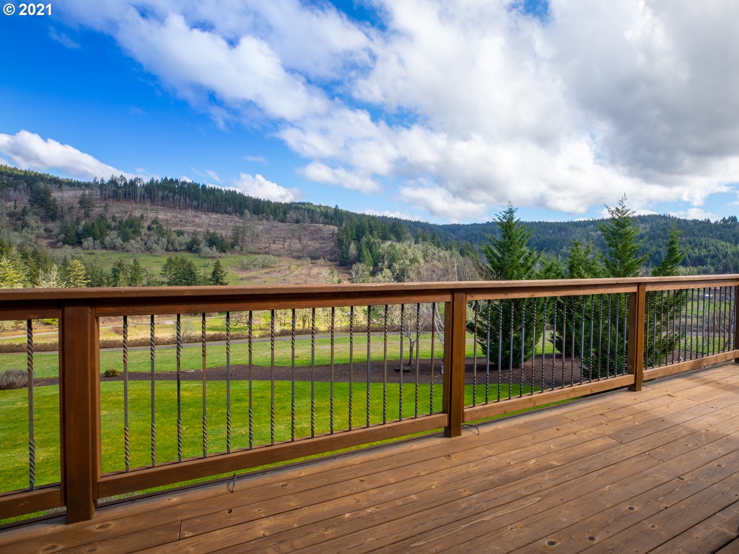 37001 Wallace Creek Road Springfield, OR 97478 - Photo 14 of 31 a view of a balcony with wooden floor and fence