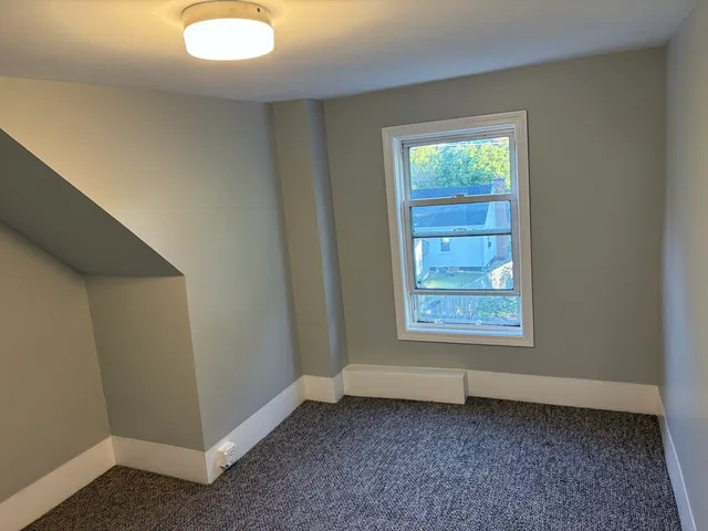 a view of a room that has a window in it