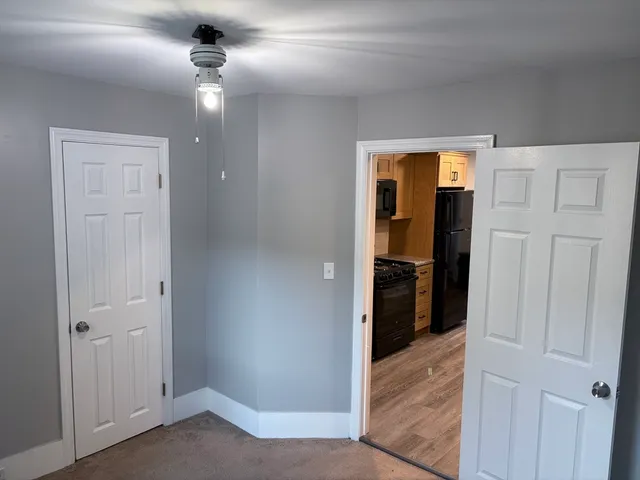 a view of a hallway with a bedroom