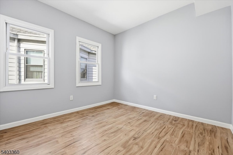 76 Riggs Place, Unit 2 West Orange, NJ 07052 - Photo 17 of 24 a view of empty room with wooden floor and fan